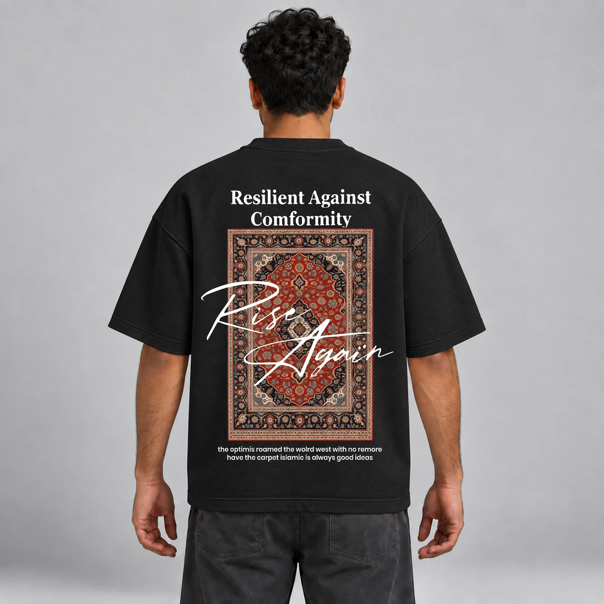 Model wearing KIFL Rise Again oversized black tee – straight back view