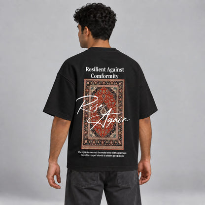 Model wearing KIFL Rise Again oversized black tee – three-quarter back view