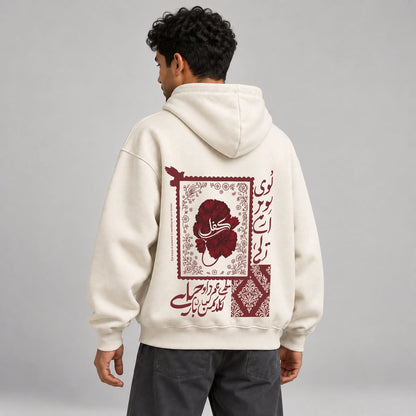 Model wearing KIFL Urdu Floral oversized hoodie – three-quarter back view